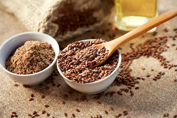 Flax seeds on spoon and in bowl