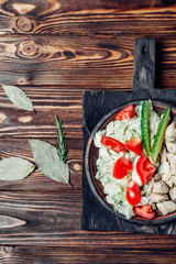chicken meat chopped on a wooden background on a kitchen board