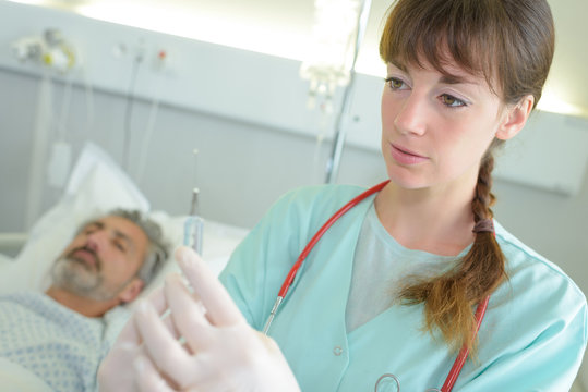 Nurse Or Doctor Preparing An Injection