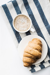Cappuccino on a striped tablecloth. Morning coffee.