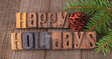 Happy Holidays Text on a Rustic Wooden Background