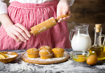 Making dough by female hands at bakery