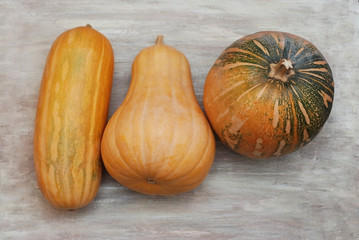 Autumn pumpkins on wooden board table. Top view with copy space