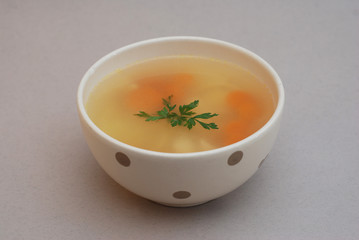 Chicken Soup in bowl isolated on gray background