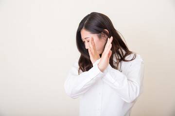 young asian woman crossing arms
