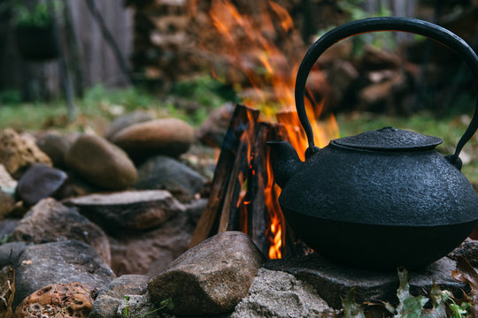 Cast Iron Kettle By A Camping Fire