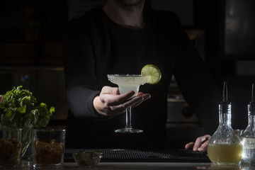 Man working at cocktail bar