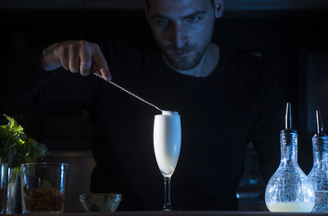 Man working at cocktail bar