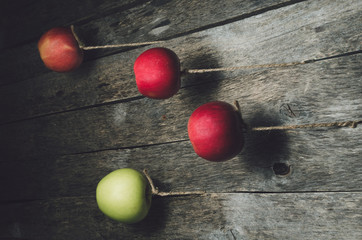 The apples are floating in the air on the background texture old wooden boards