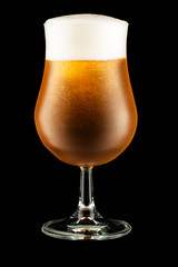 Glass of beer isolated on black background