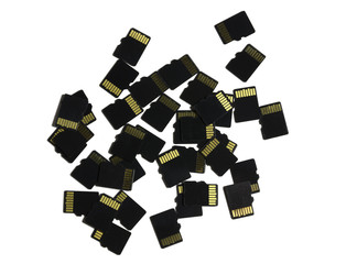 several flash micro SD cards scattered on white background
