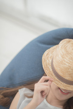 Lovely girl lying on a shofa in white room.