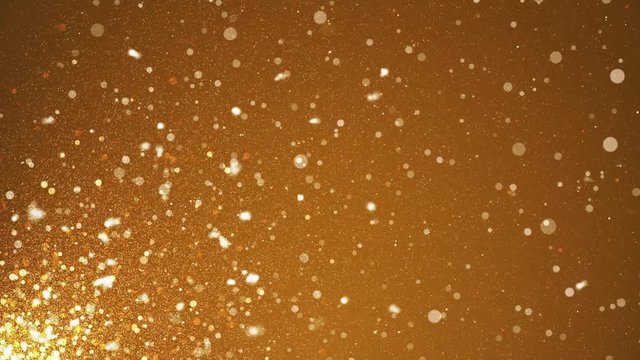 Shining Flying Glittering gold sparkles Glittering in a gold background