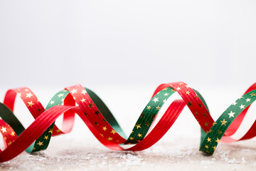 Christmas gift ribbon and gray background.