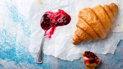  Breakfast Continental  with Fresh  Croissants on a Background of white paper Delicious Baking with Berry Jam  Top View Copy space for Text