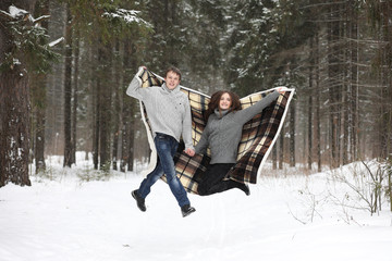 pair of lovers on a date winter afternoon in a snow blizzard