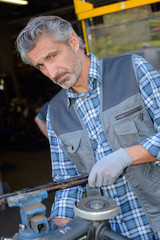 machinist fixing a machine