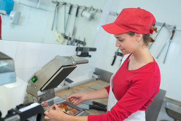 female butchers in a supermarket at work