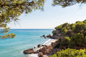 Fototapeta na wymiar View of the coastline of the Costa Dorada in Miami Platja, Tarragona, Catalunya, Spain. Copy space for text.