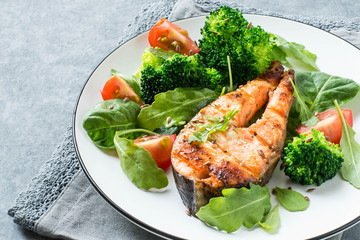 Grilled salmon steak and vegetables