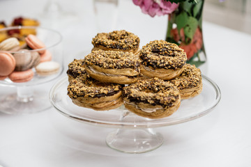 stylish luxury decorated orange candy bar for the celebration of a wedding of happy couple, cathering in the restaurant