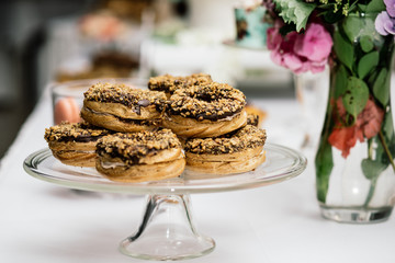 stylish luxury decorated orange candy bar for the celebration of a wedding of happy couple, cathering in the restaurant