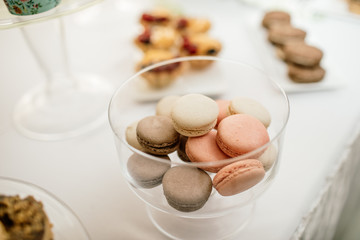 stylish luxury decorated orange candy bar for the celebration of a wedding of happy couple, cathering in the restaurant