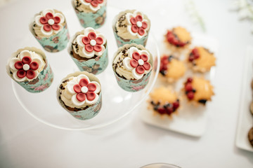 stylish luxury decorated orange candy bar for the celebration of a wedding of happy couple, cathering in the restaurant
