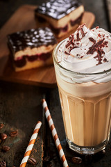 Glass of frappe coffee on table