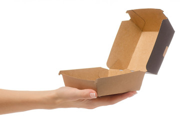 Box for a burger in a female hand 
