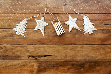 Christmas rustic decorations over wooden background