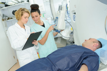 Nurses discussing patient's notes