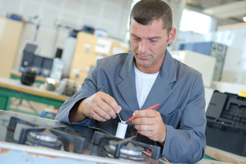 Man repairing gas hob