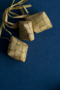 Ketupat or rice dumpling packed inside woven palm leaf pouch