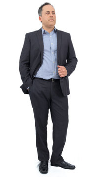 Full body image of businessman. He is wearing social clothing. Suit and social shirt..