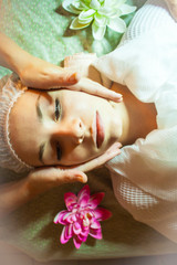 Obraz na płótnie Canvas spa salon face massage. Close-up of a young woman getting spa treatment at beauty salon. spa face massage. facial beauty treatment.