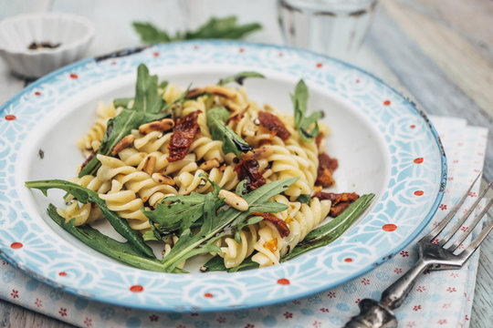 Food: Summer Salad with Noodles, dried tomato, rocket, roasted pine nuts and balsamico