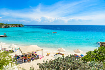 Porto Marie beach - white sand Beach with blue sky and crystal clear blue water in Curacao,...