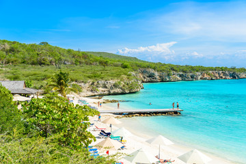 Porto Marie beach - white sand Beach with blue sky and crystal clear blue water in Curacao,...
