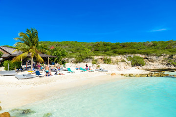 Fototapeta na wymiar Porto Marie beach - white sand Beach with blue sky and crystal clear blue water in Curacao, Netherlands Antilles, a Caribbean Island