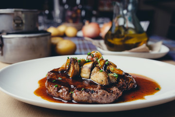 Burger with mushrooms served on plate