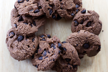 Chocolate cookies on wooden table. Chocolate chip cookies top view