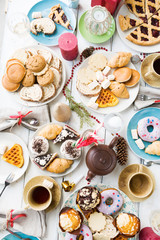 Assortment of delicious pastry on served festive table
