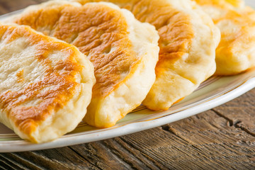 Fresh patties on the wooden table