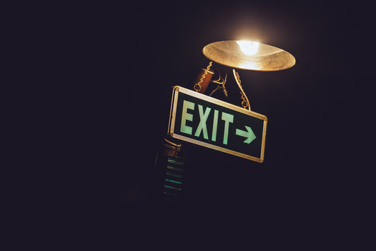 Exit sign in the gloom