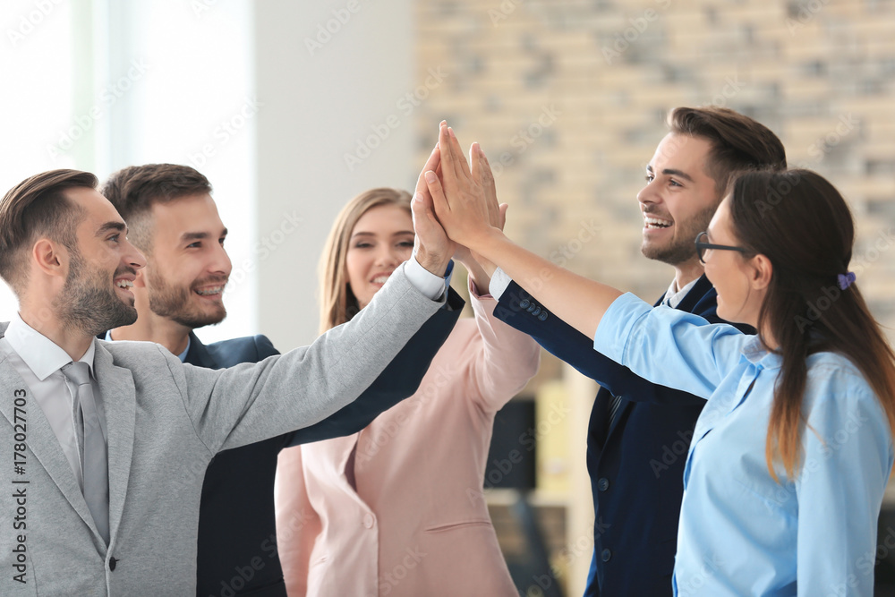 Wall mural Team of young marketing managers in office