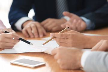 Team of young managers discussing project in office © Africa Studio