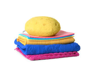 Sponge and many different rags on white background