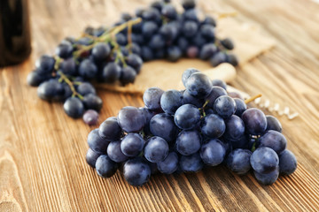 Fresh ripe grapes on wooden background