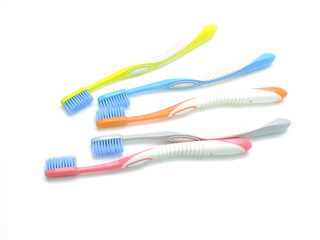 multicolored toothbrushes isolated on white background